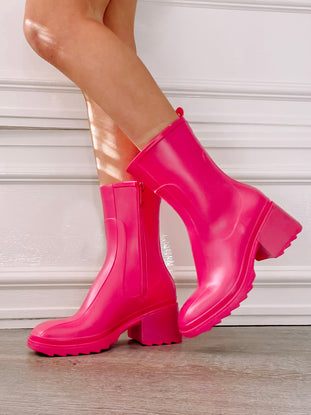 Hot pink Storm Stunner boots with chunky heel & side zip.