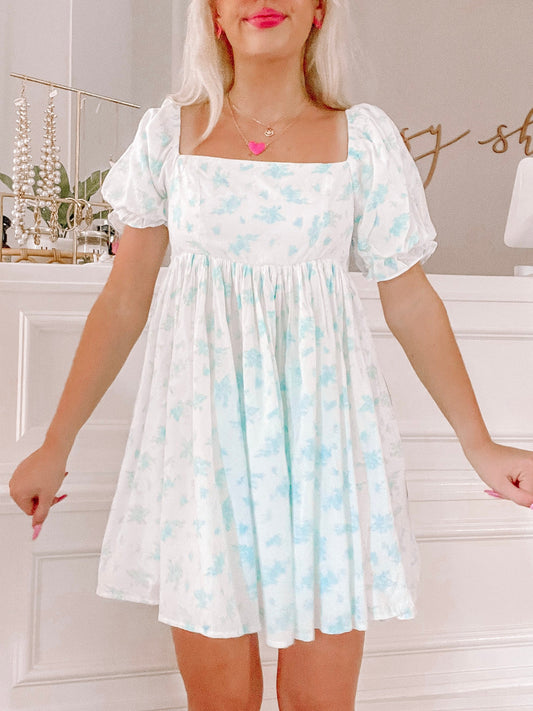 All Dolled Up Blue toile mini dress with puff sleeves from Sassy Shortcake, shown on a model.