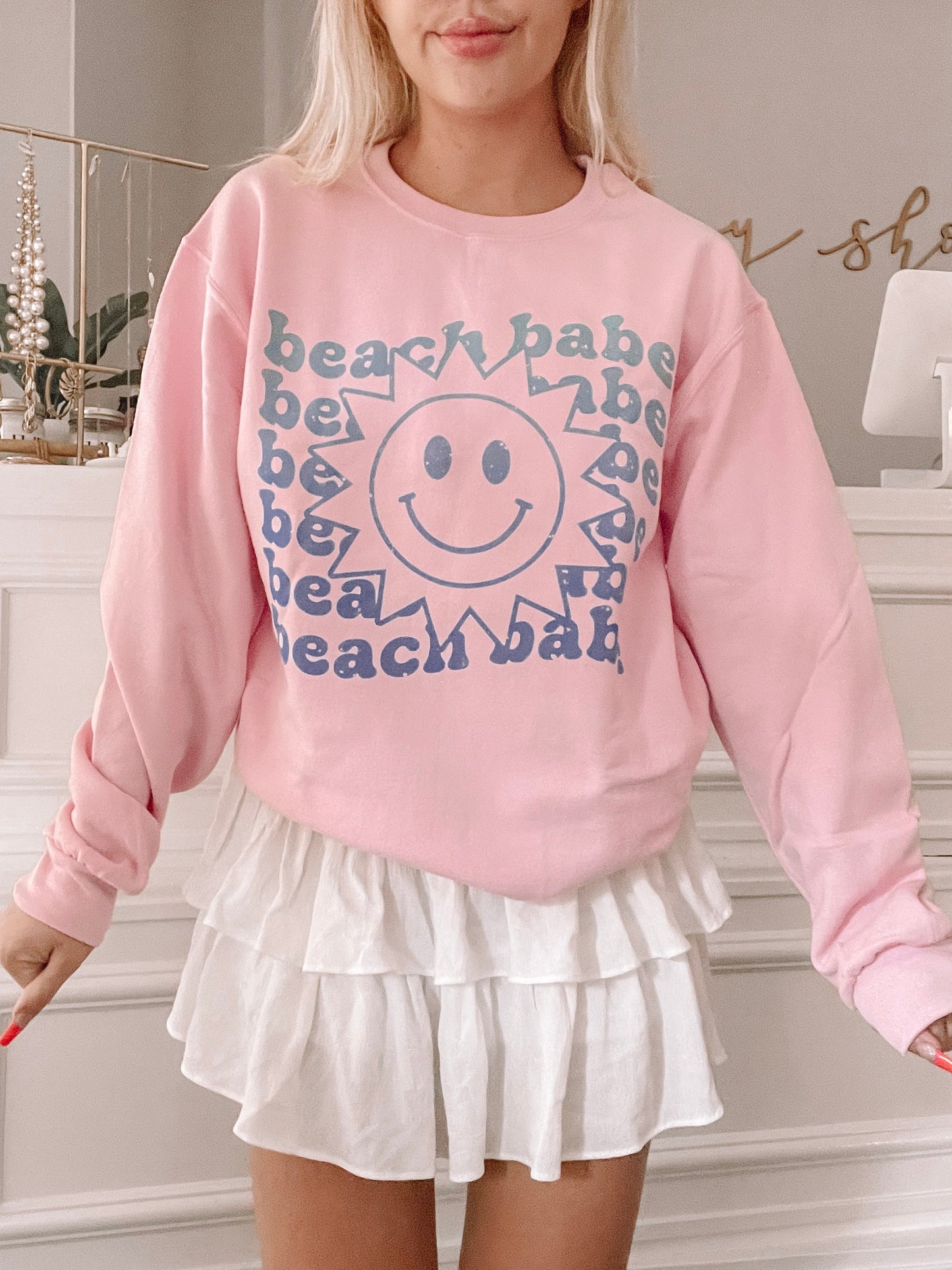 Pink Sun Smiley Beach Babe sweatshirt with a retro design.