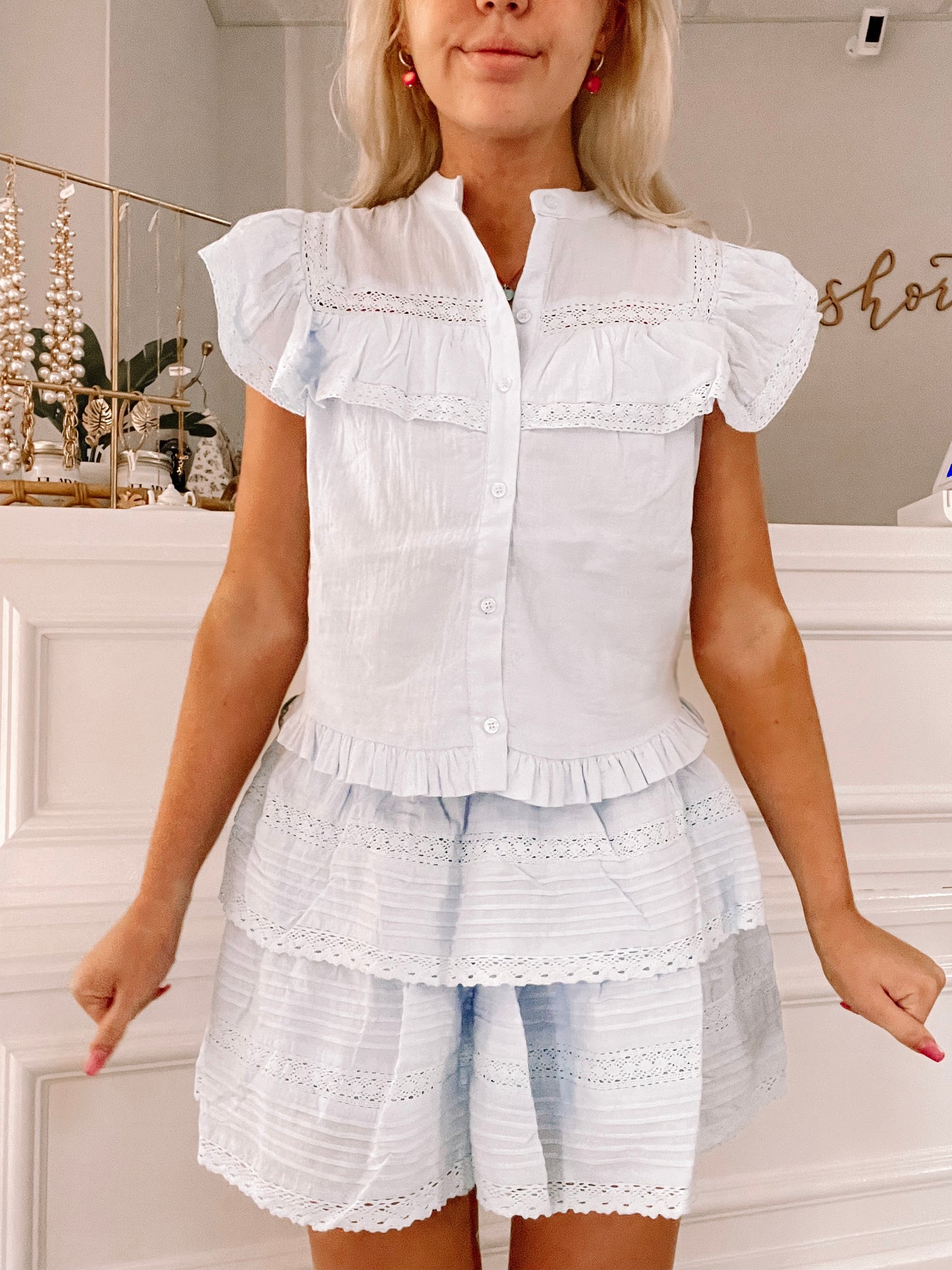 Light blue eyelet top and tiered skirt set, styled against a white backdrop.