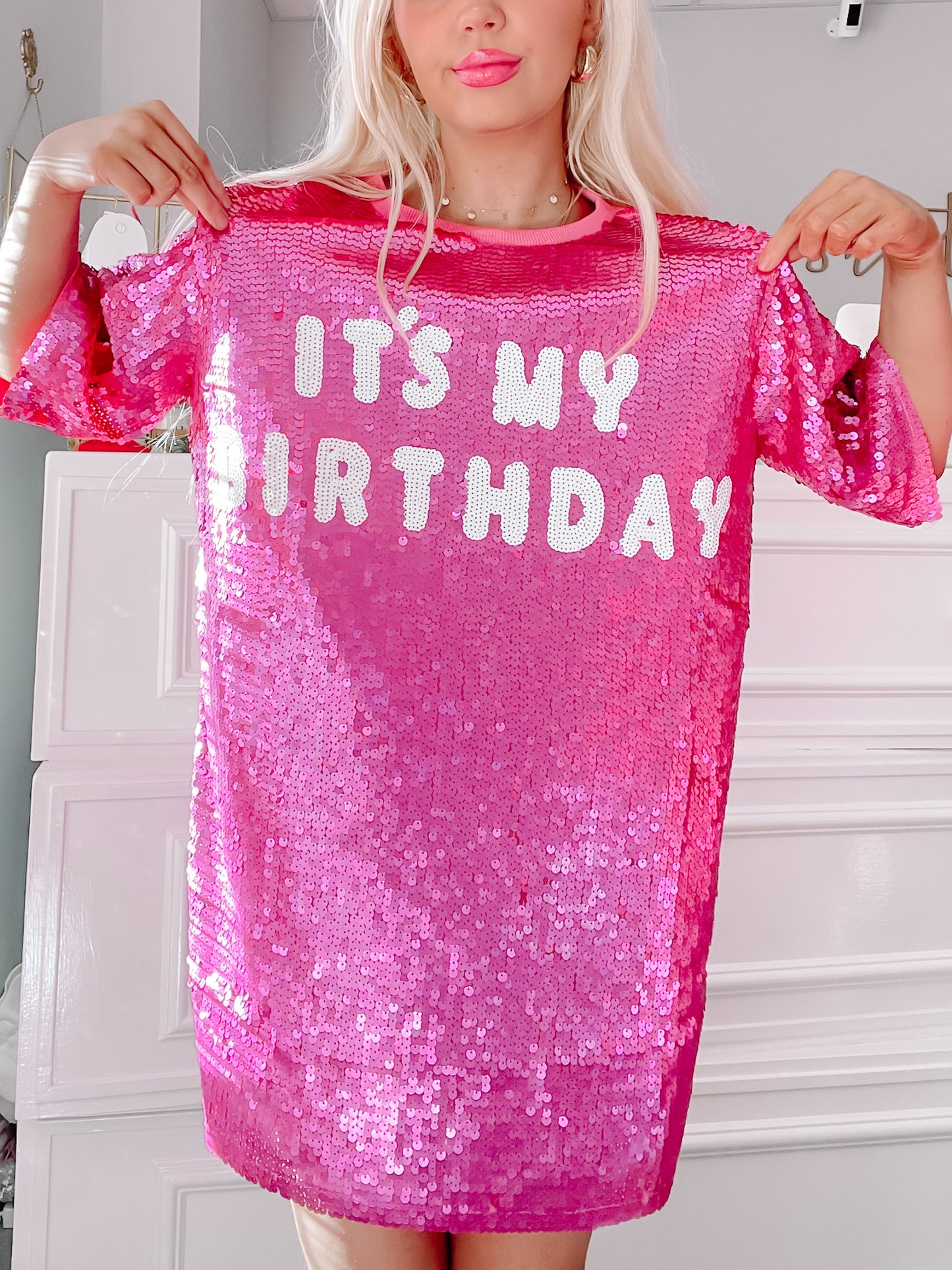 Pink sequin mini dress featuring "It's My Birthday" in white lettering; perfect for celebrations.