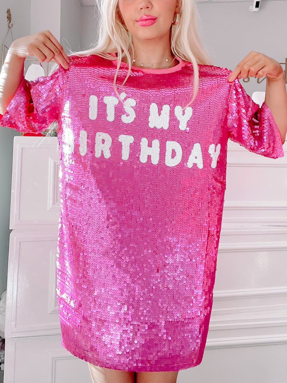 Pink sequin mini dress featuring "It's My Birthday" in white lettering; perfect for celebrations.