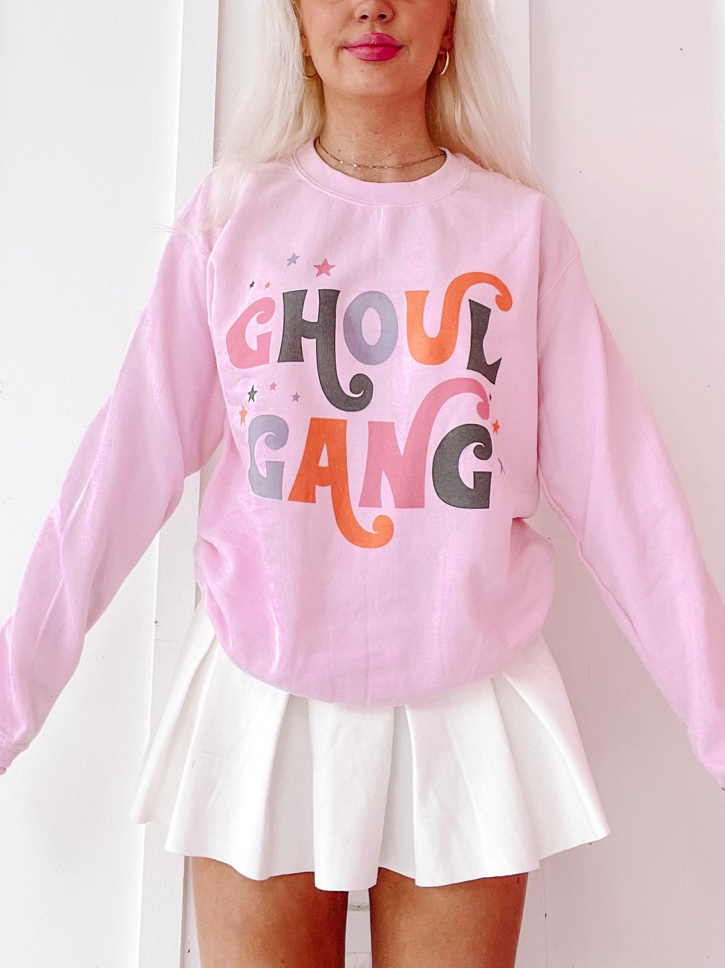 Pink Ghoul Gang crewneck sweatshirt with retro-style lettering and star details from Sassy Shortcake