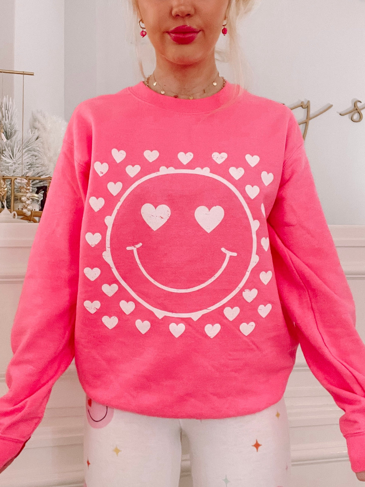 Pink Heart Eyes Crewneck sweatshirt with white smiley face and hearts design from Sassy Shortcake
