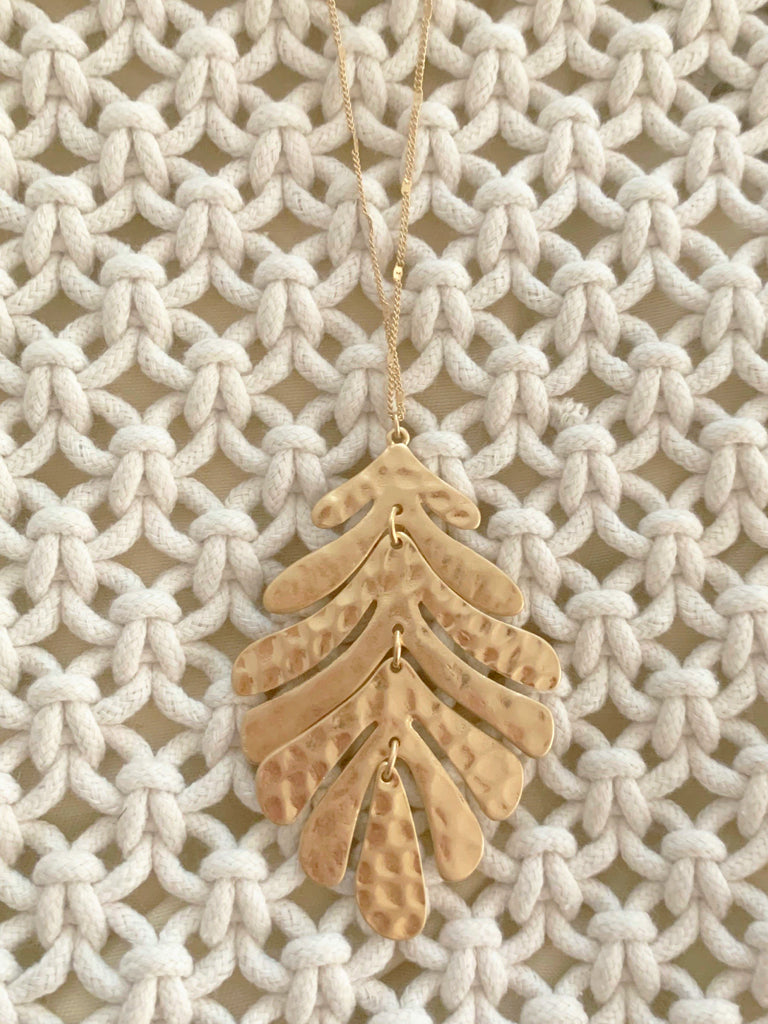 Gold Palm Paradise necklace with hammered leaf pendant