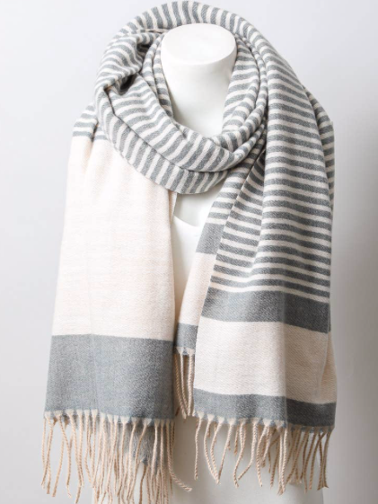 Soft Charcoal Stripe Scarf: Gray and cream striped knit scarf with fringe, perfect for adding warmth and style.