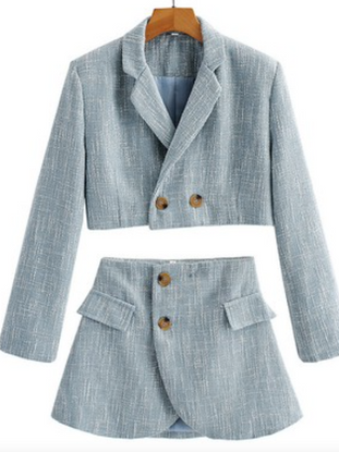 Light blue cropped blazer and mini skirt set, textured fabric.