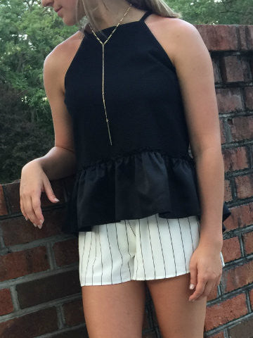 Edin Top | Black: Black ruffled halter top with a relaxed fit, perfect for summer.