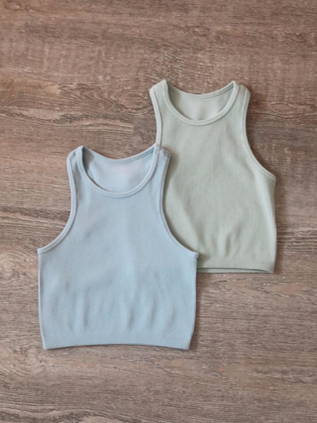 Seamless ribbed tank tops in light blue and mint green; perfect for layering.