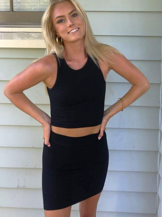 Black ribbed knit mini skirt; stylish and comfortable.