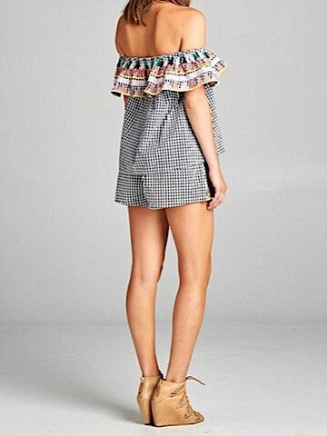 Black and white gingham off-the-shoulder top and shorts set; embroidered trim detail.