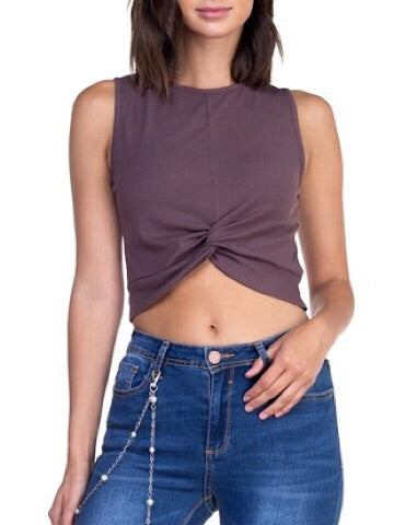 Mauve sleeveless knotted crop top paired with dark wash jeans.