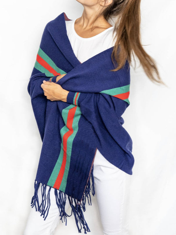 Navy blue Big Dreams Wrap with teal, red, and rust stripes and fringe trim.