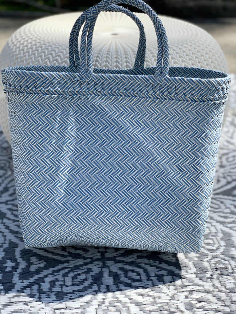 Blue Muse Tote: Woven plastic tote bag with blue and white geometric pattern.