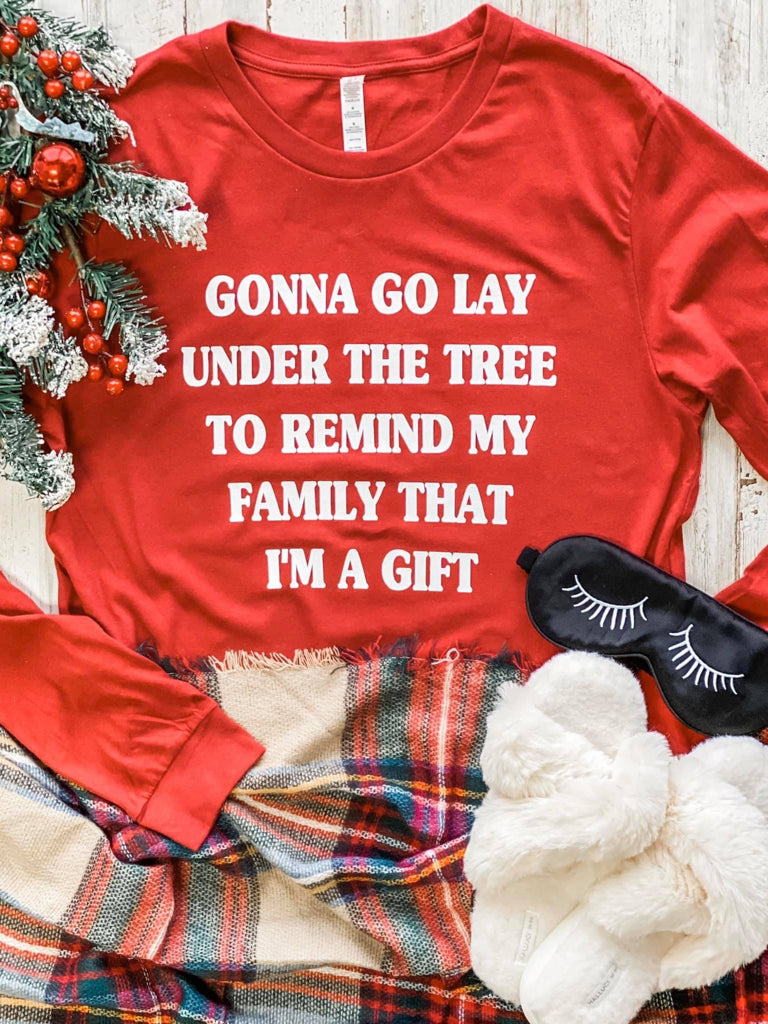 Red long-sleeve "Gonna Go Lay Under the Tree" Christmas tee shirt.
