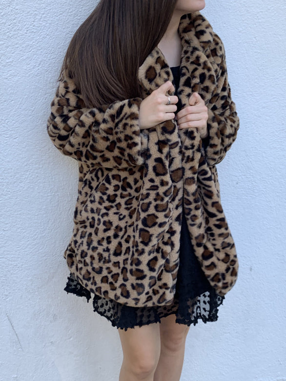 Brown and tan leopard print faux fur coat, open front.