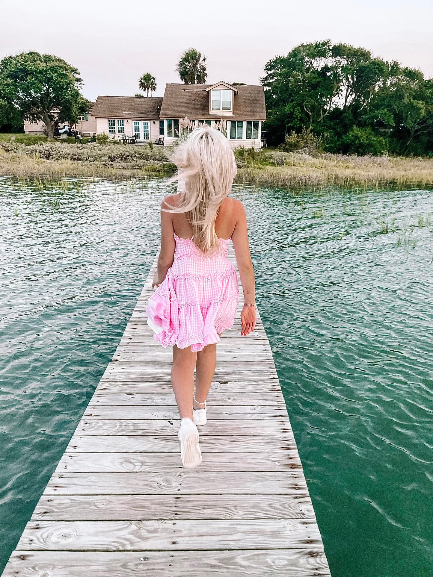 Wrenley pink gingham tiered mini dress, perfect for summer.