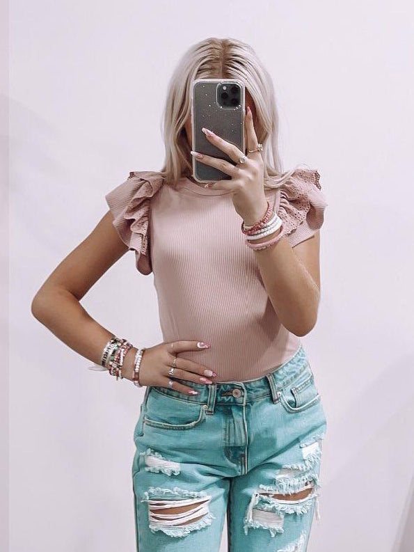 Londyn Top in Rose: Ribbed, ruffle-sleeve bodysuit, perfect for a casual yet chic look.