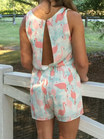 Pink flamingo romper, open back, light blue background, summer fashion