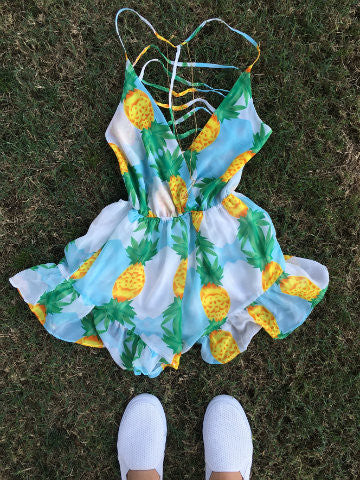 Pineapple Queen Romper: Light blue romper with pineapple print, criss-cross straps, ruffled hem.