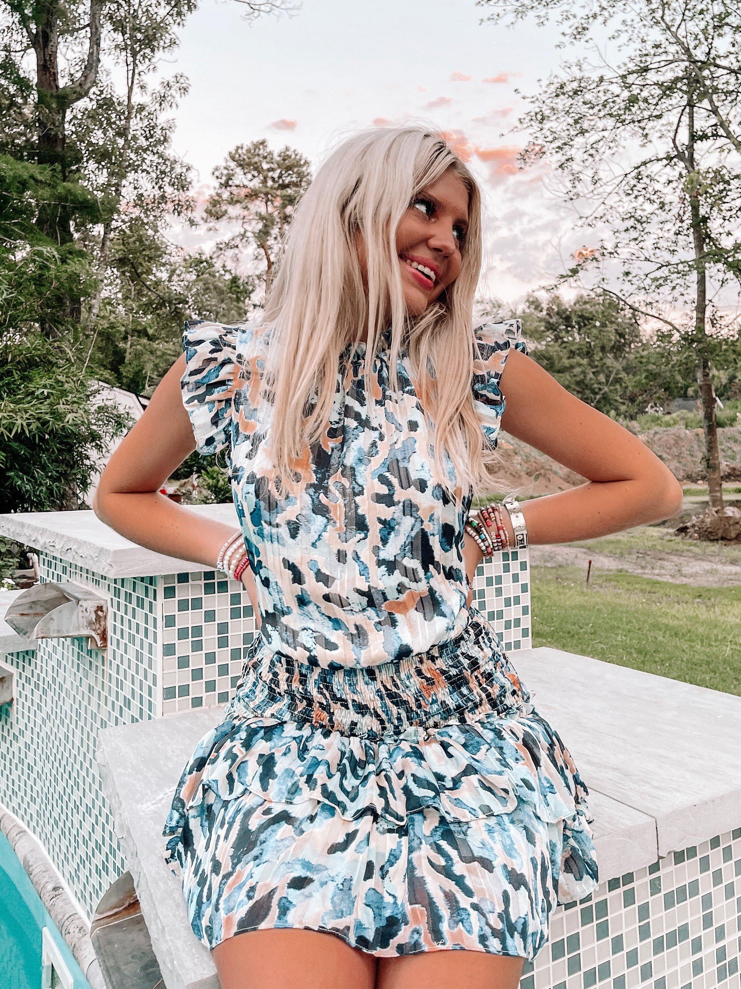 Winona Dress: Blue abstract print mini dress with ruffle details.