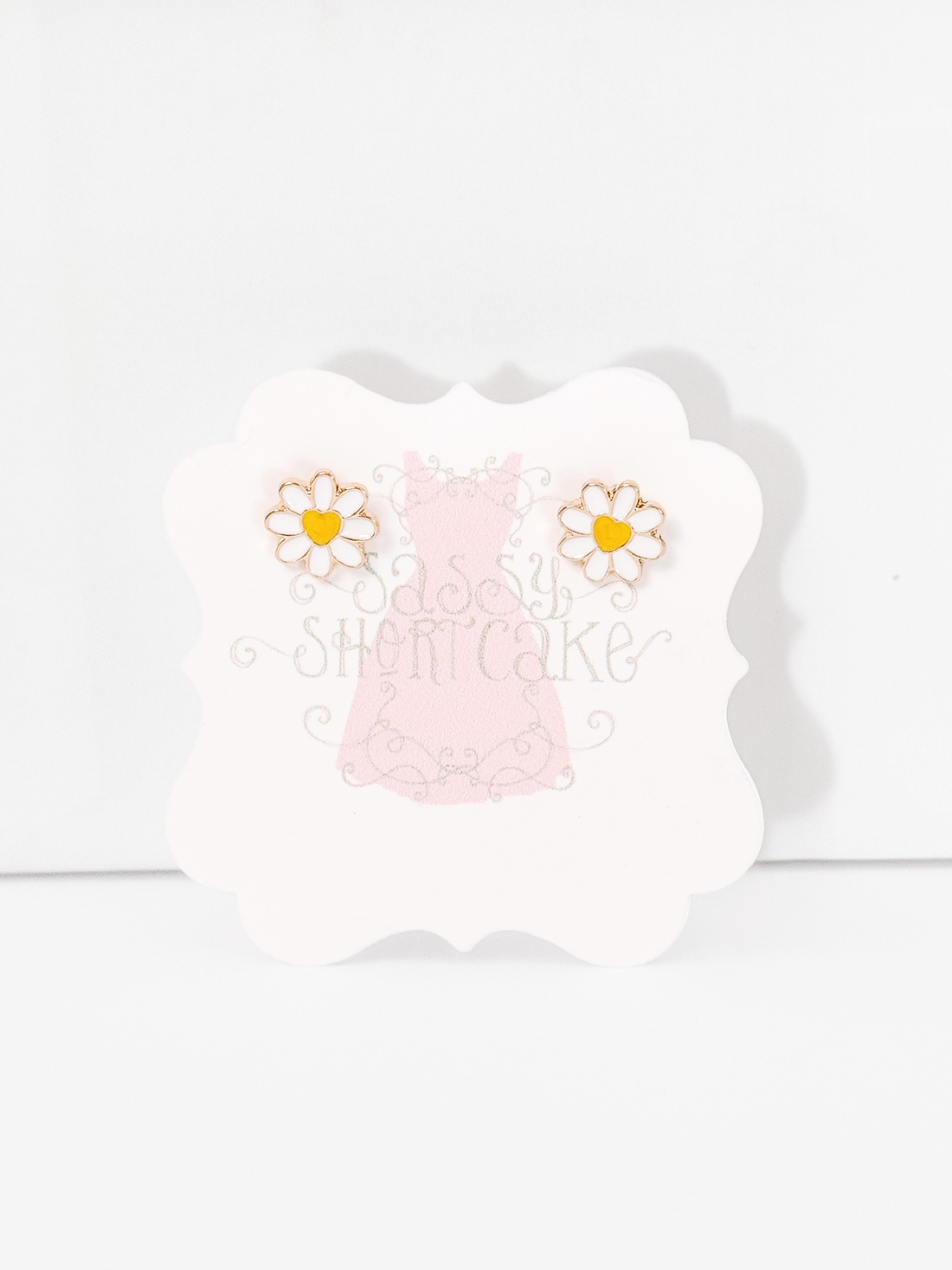 Daisy Love gold-tone daisy earrings with yellow heart centers
