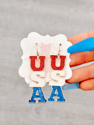 Glittery USA earrings in red, white, and blue.
