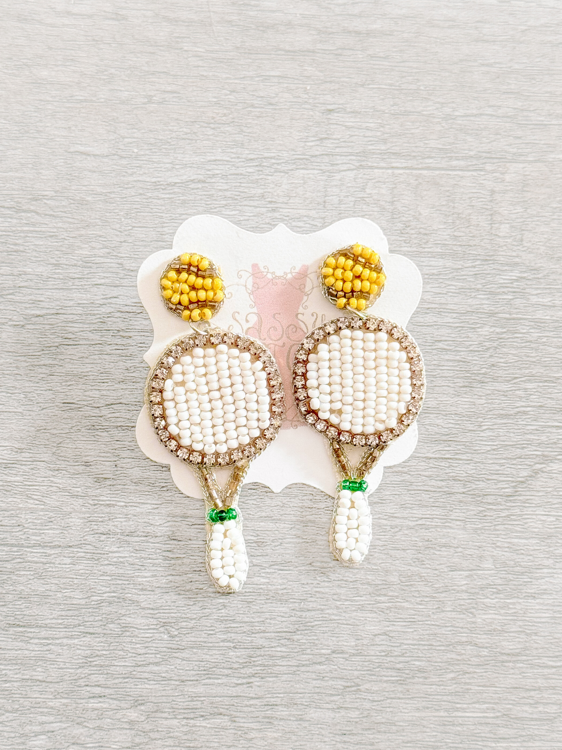 Beaded tennis racquet earrings with yellow tennis ball accents
