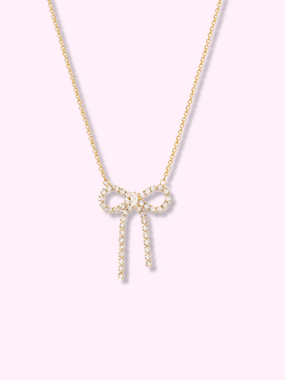 Gold Shimmer Bow necklace with sparkling cubic zirconia accents.

