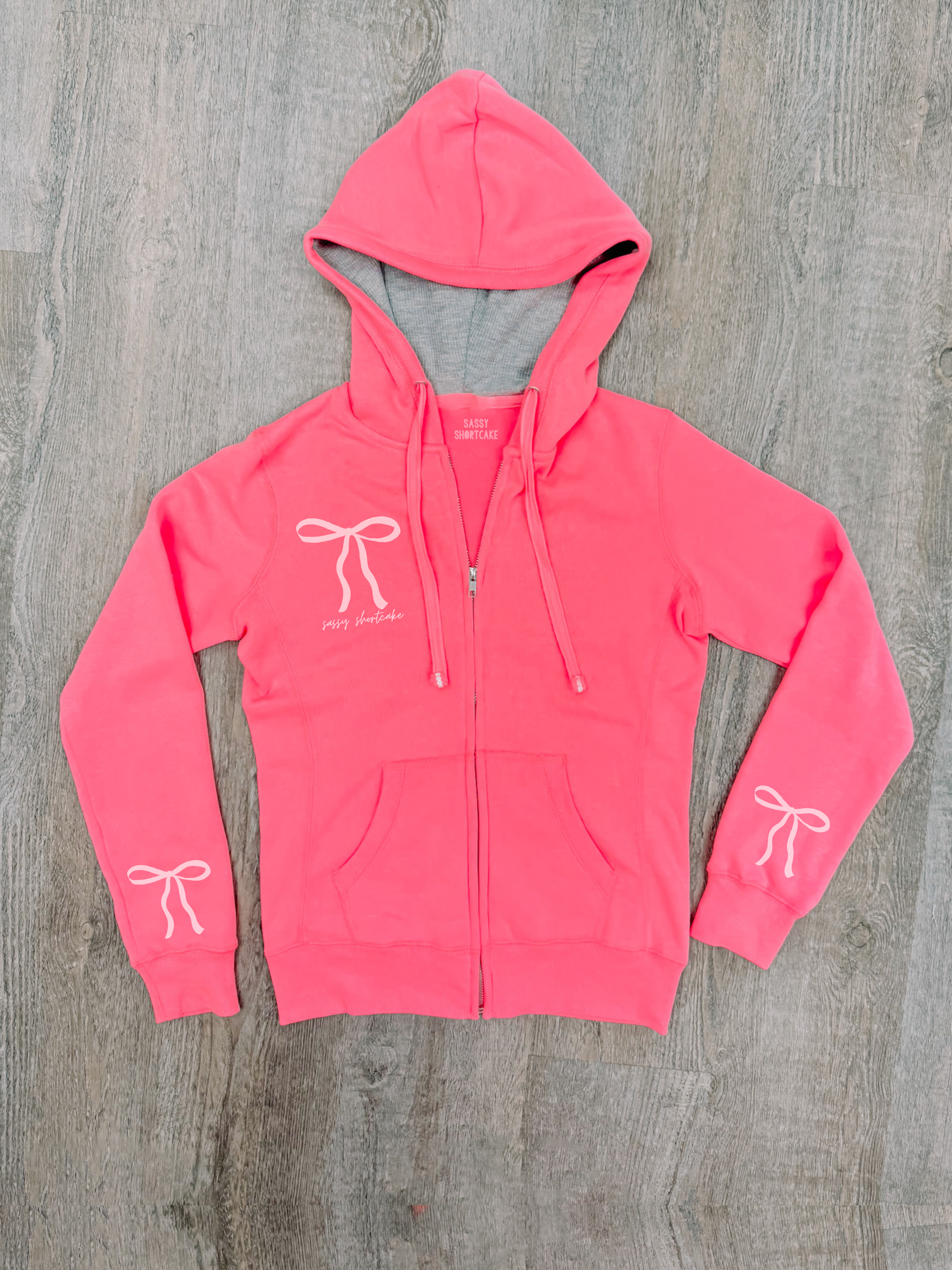 Neon Pink Bow Zip Up  | Sassy Shortcake Boutique | sassyshortcake.com
