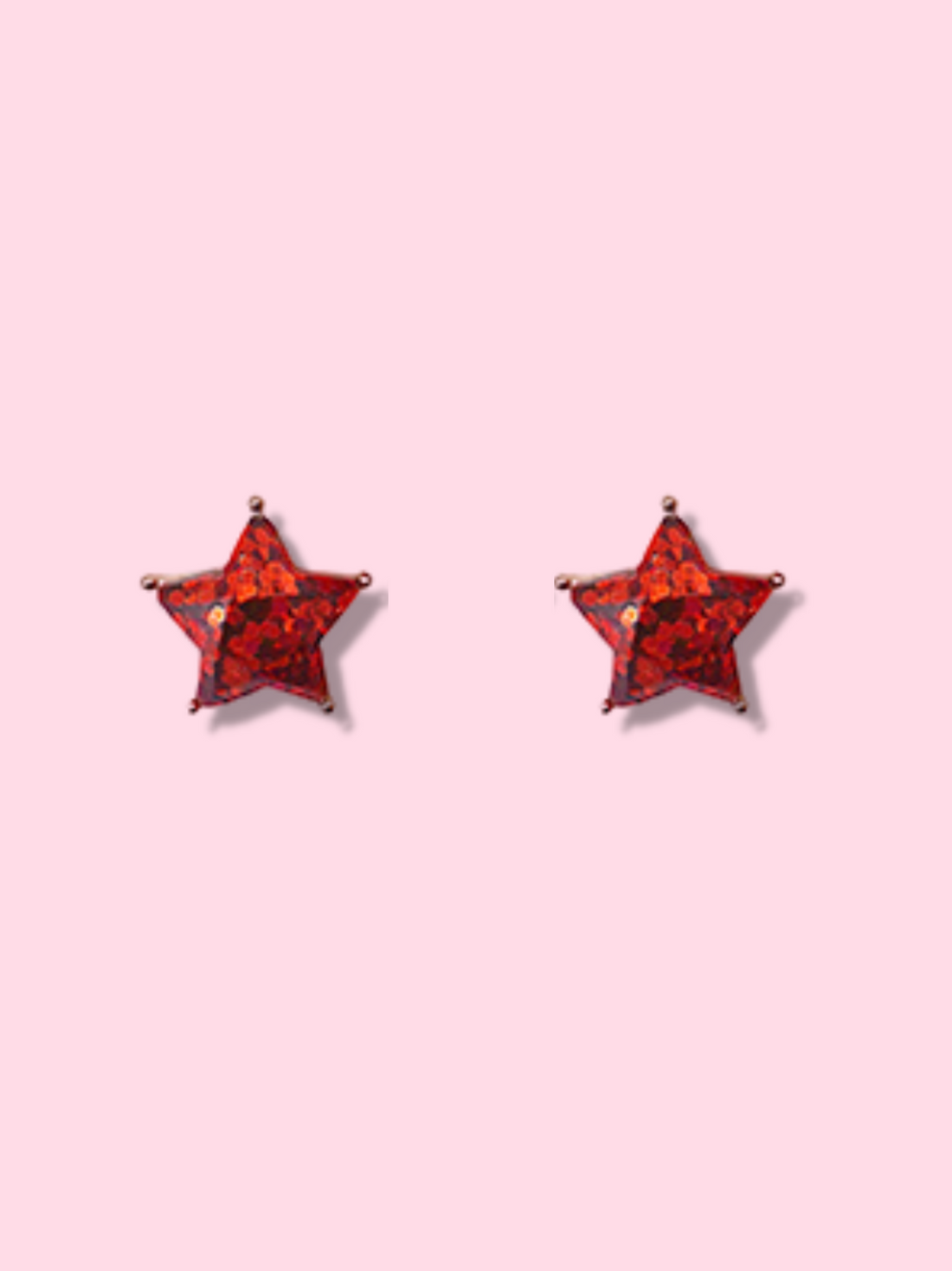 Red glitter star-shaped stud earrings on a pink background.
