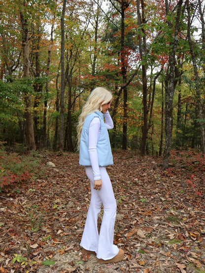 Alpine Air Vest - Sassy Shortcake - outdoor side view of light blue vest walking pose