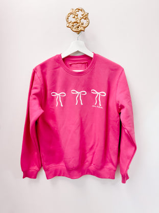 Sassy Shantae Blushing Bow Kids Crewneck, berry pink sweatshirt with three white bows.
