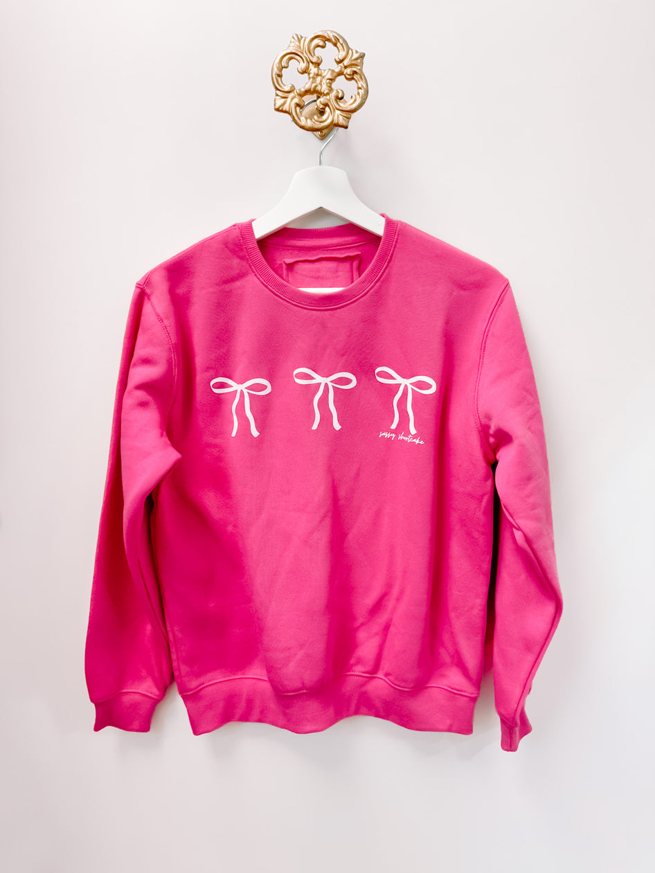 Sassy Shantae Blushing Bow Kids Crewneck, berry pink sweatshirt with three white bows.

