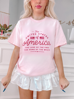 Pink United States of America tee, patriotic design, women's fashion.
