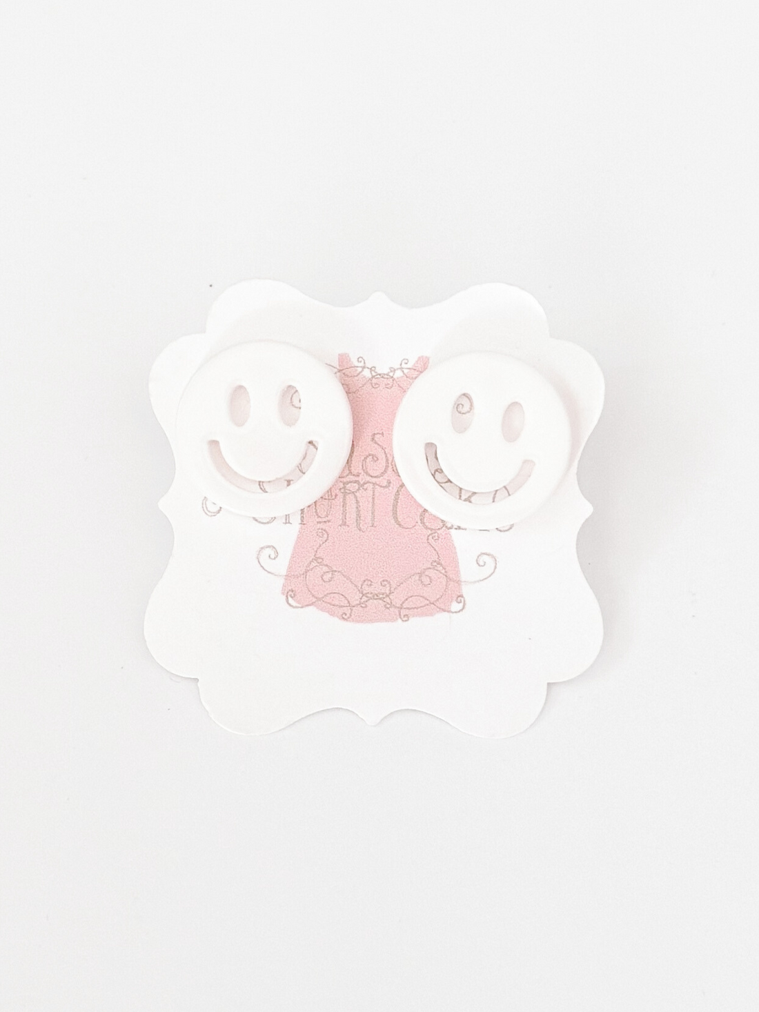 White Sonic Smiles smiley face earrings
