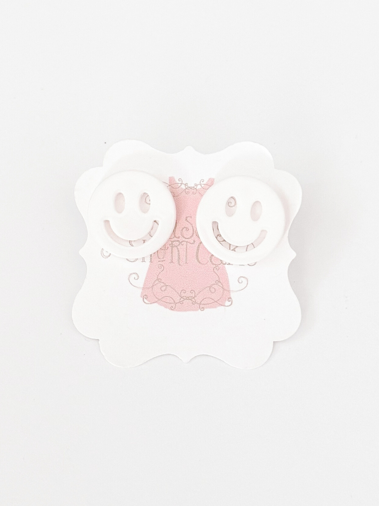 White Sonic Smiles smiley face earrings

