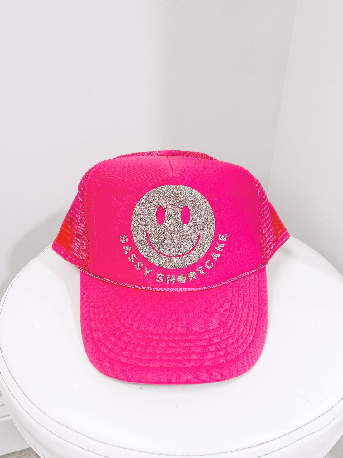 Pink Sassy Shortcake trucker hat with silver glitter smiley face
