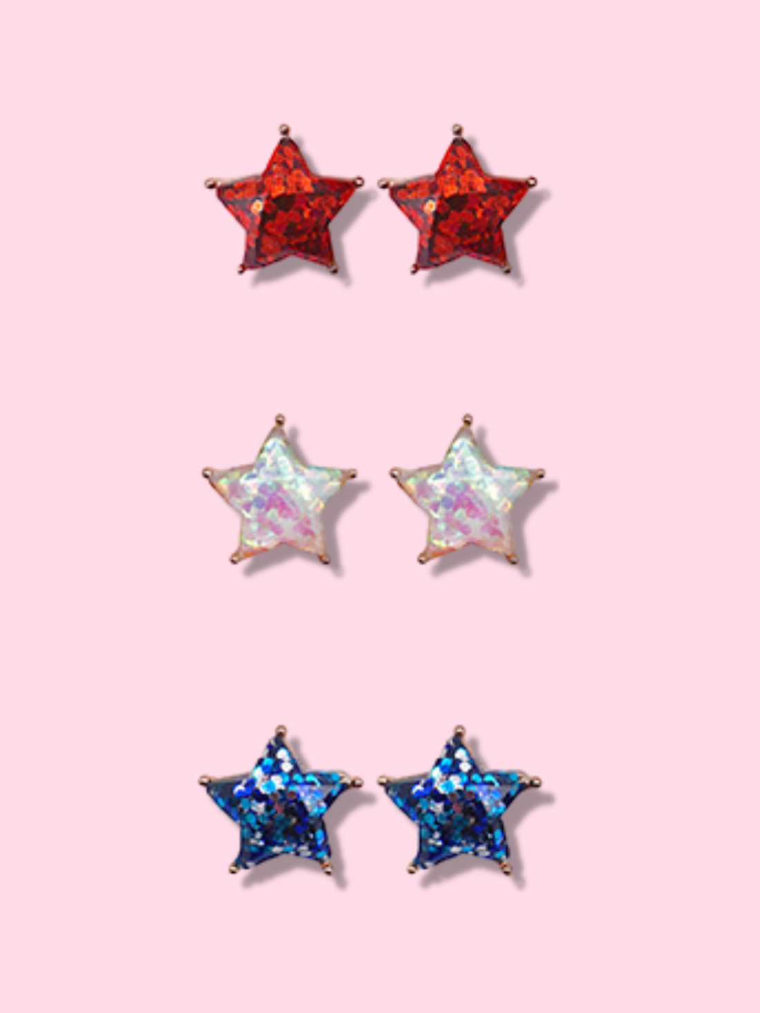 Sparkly star-shaped earrings in red, iridescent, and blue glitter.
