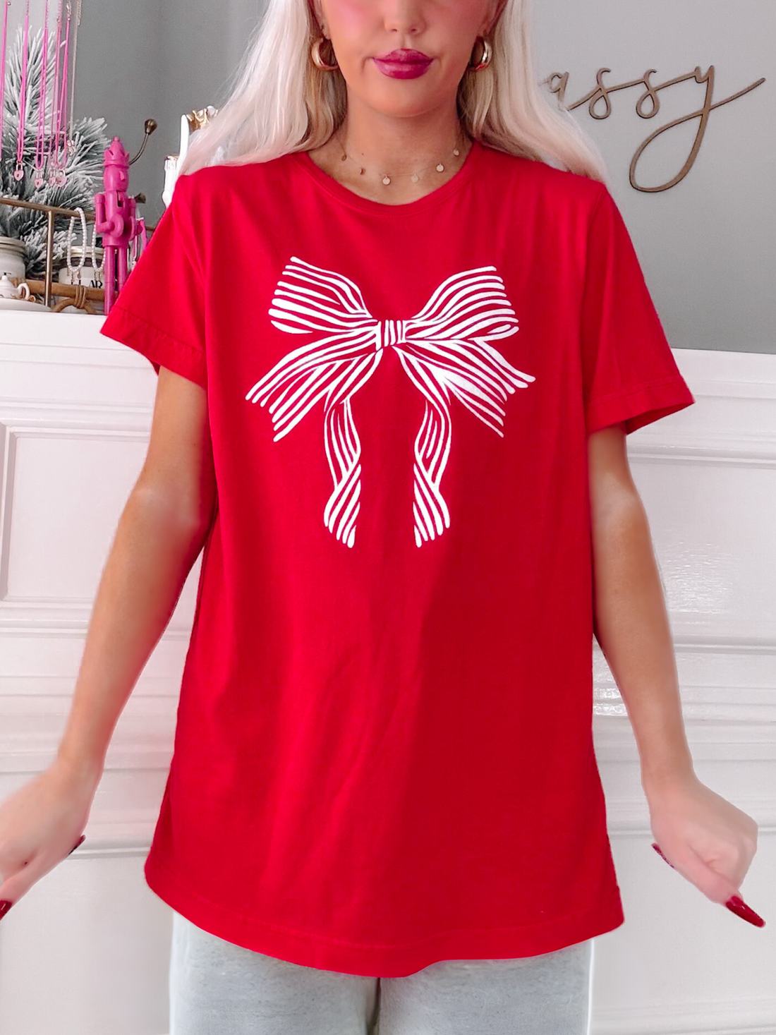 Red Lexi Bow Tee featuring a white striped bow graphic.
