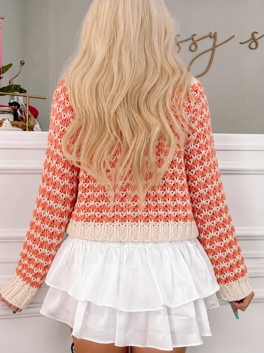 Harvest Hayride chunky knit cardigan in rust and cream with a V-neck and wood buttons, styled with a white ruffle skirt - back view - from sassy shortcake