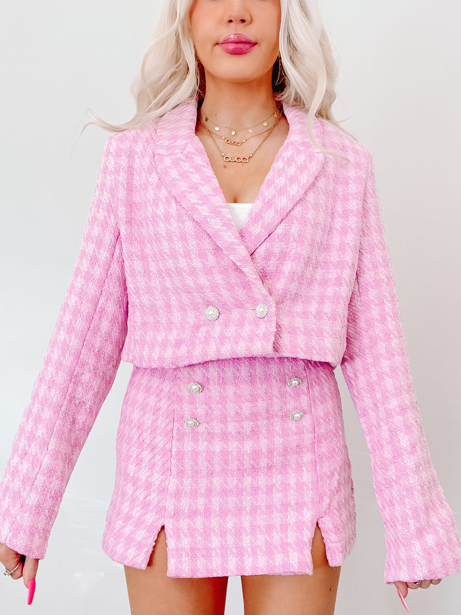 Paris Pink Pearl Set: Pink tweed cropped blazer & skirt set, featuring pearl buttons.
