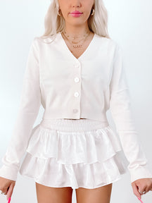 Ivory Spencer Cardigan:  Cropped, button-front knit cardigan in white.
