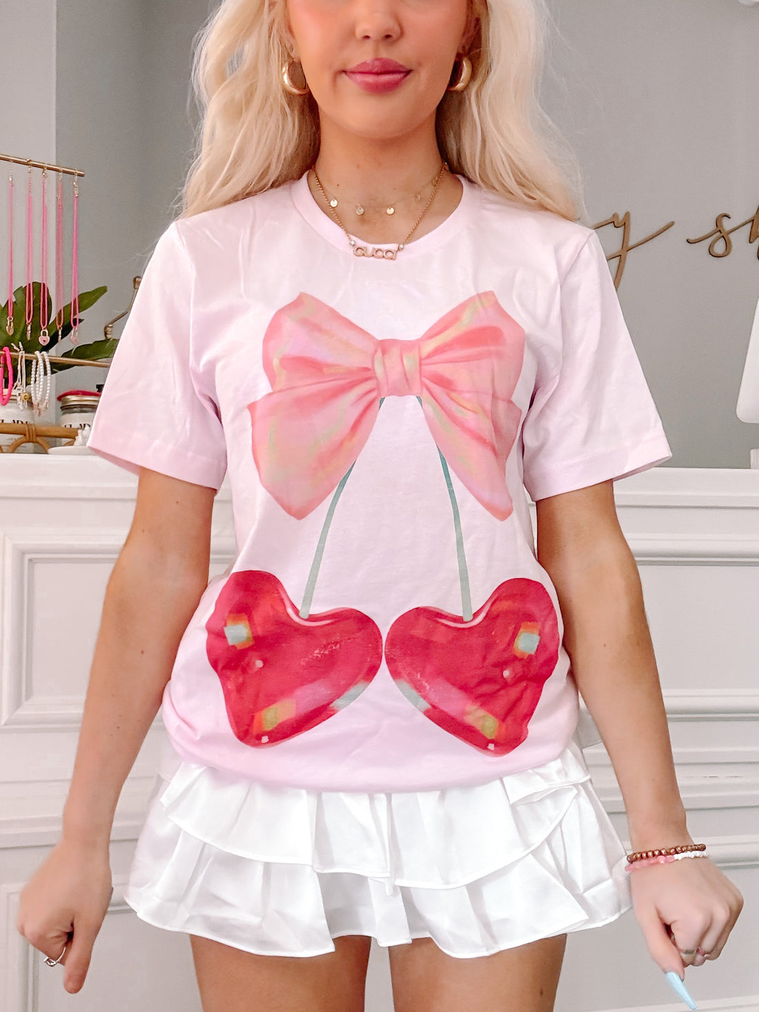 Pink Cherry Bow Tee featuring a cute cherry and bow graphic.
