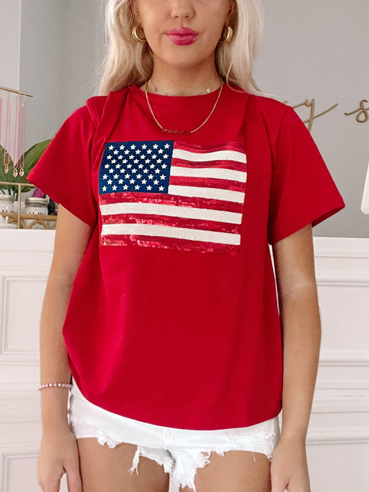 Sequin American flag detail on a red short-sleeve tee.