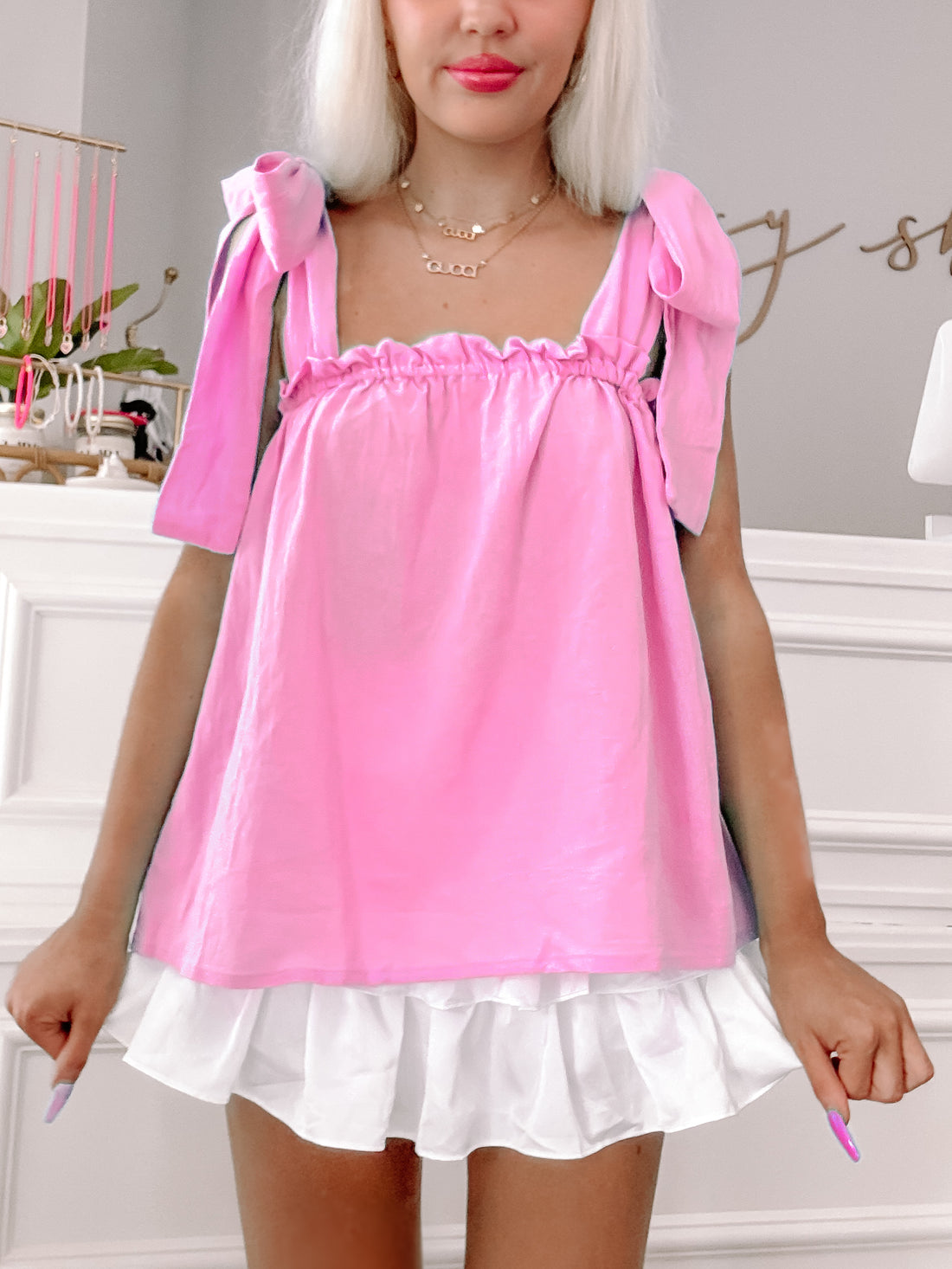 Tara Ribbon Top in pink:  Pretty pink top with ribbon shoulder ties and ruffled detail.
