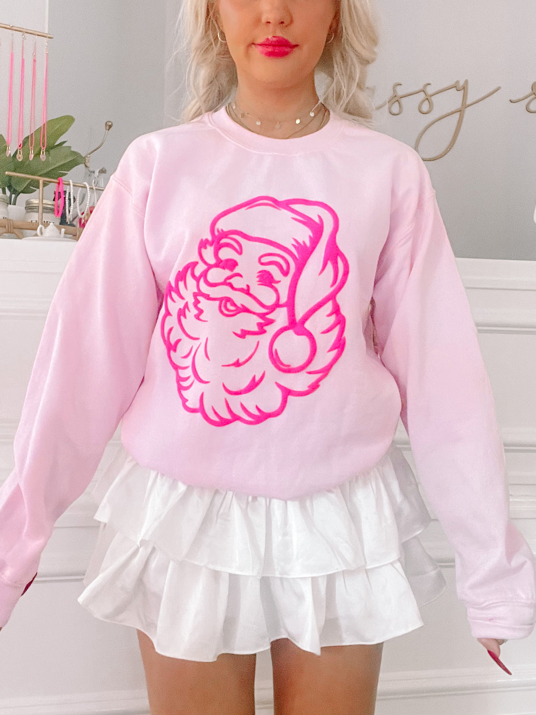 Pink crewneck sweatshirt featuring a hot pink neon Santa graphic from Sassy Shortcake; pink crewneck with hot pink Santa graphic 

