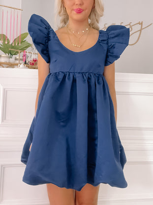 Navy blue Yield My Way dress with puffed sleeves.
