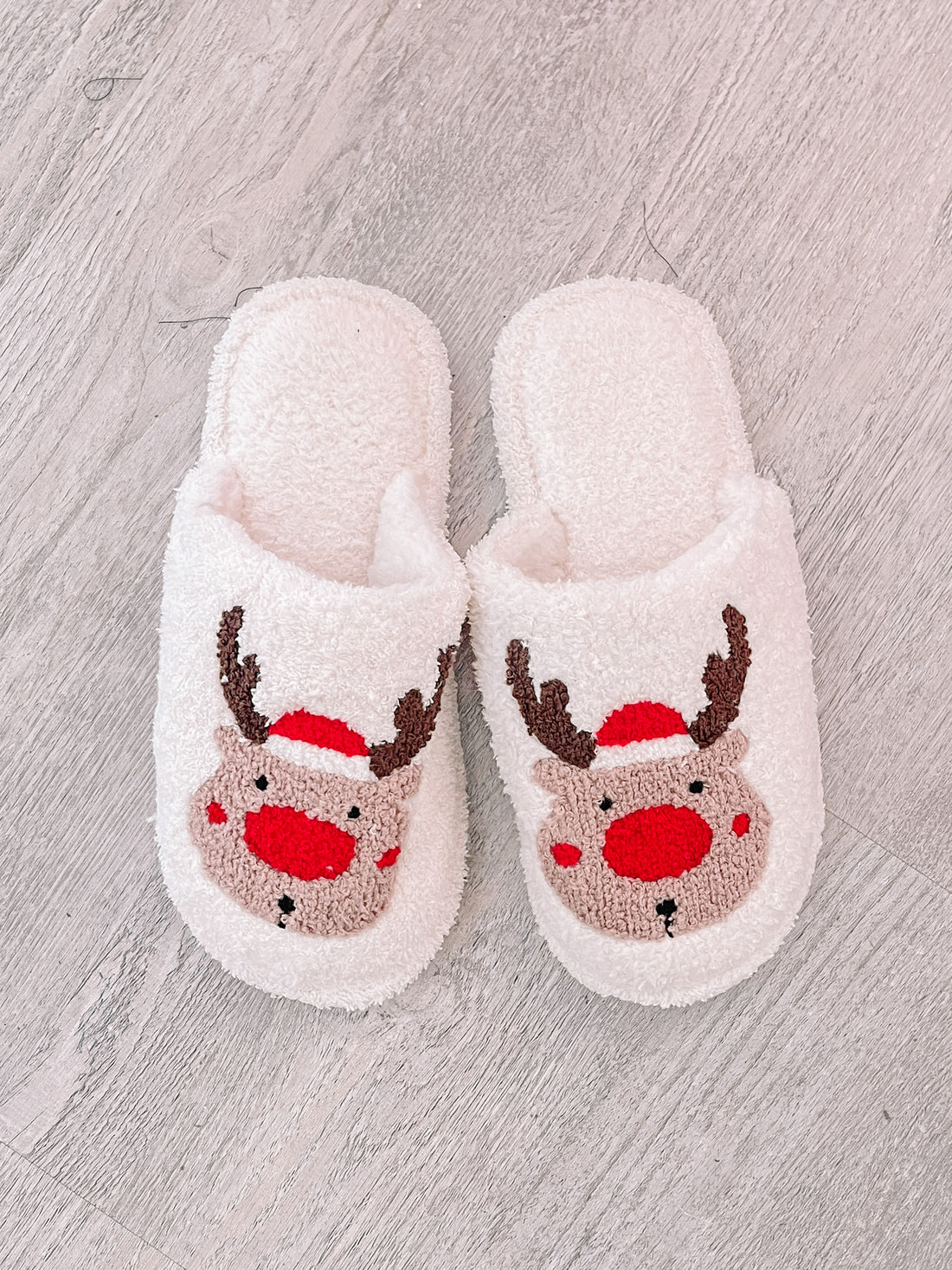 Cozy white reindeer slippers for Christmas.
