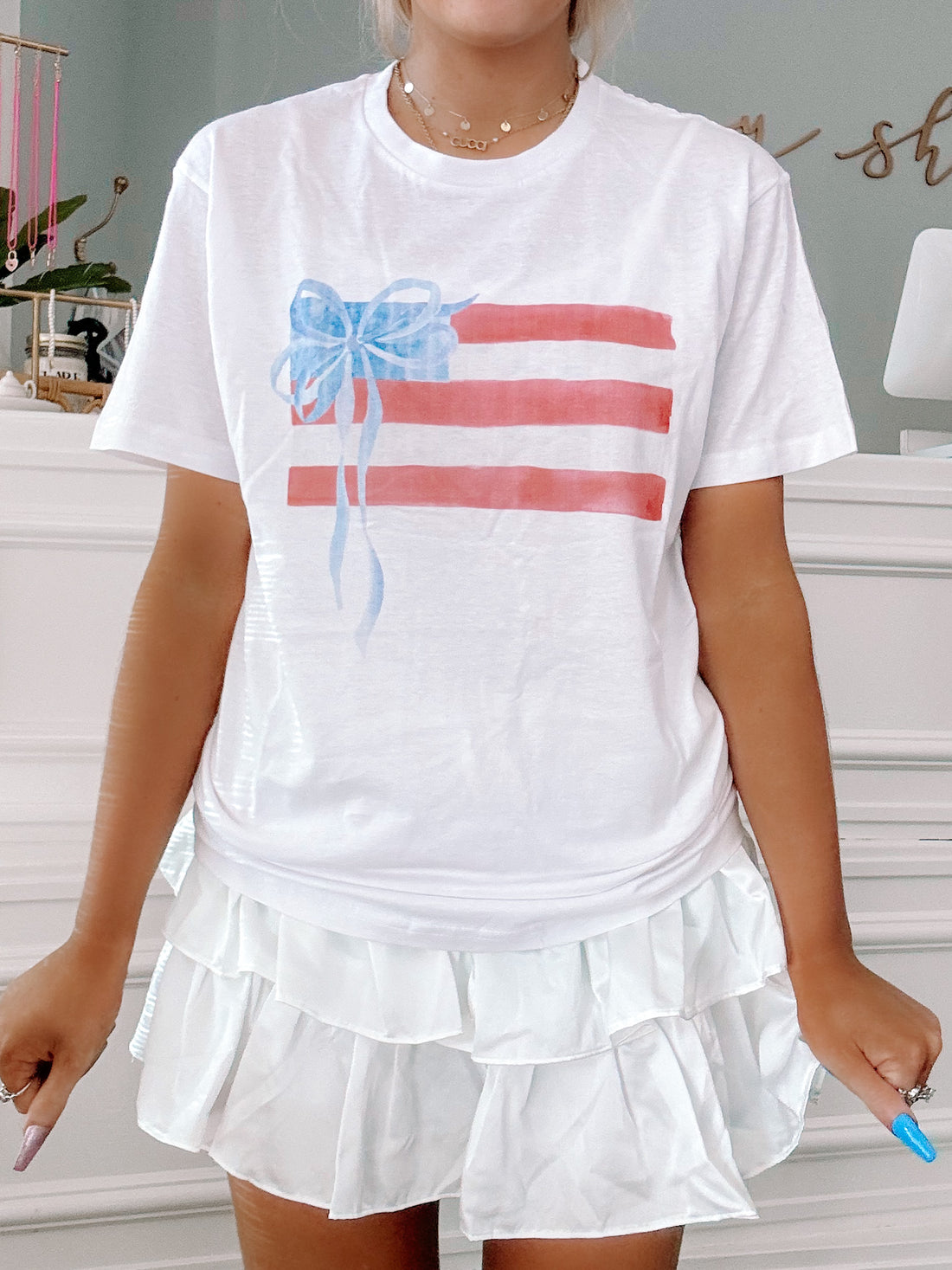 White Patriotic Bow Tee featuring watercolor American flag design.
